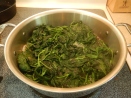 steaming nettle leaves in pot on stove